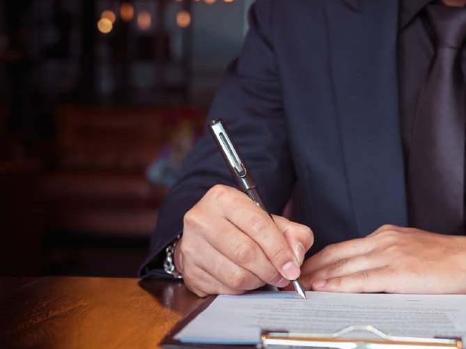 Professional signing a contract