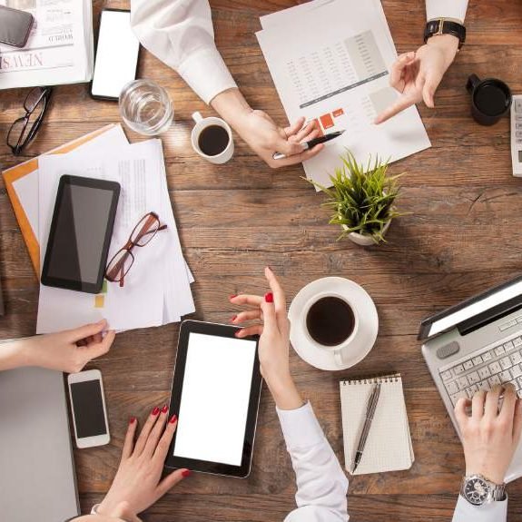 Advisors working together at a desk